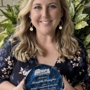 Meredith Draughn holding award