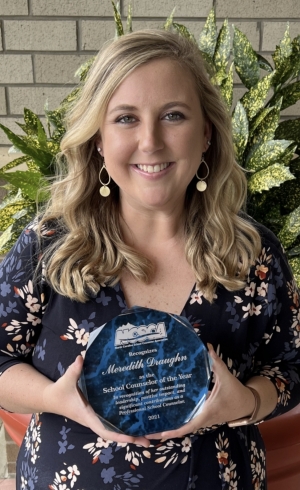 Meredith Draughn holding award